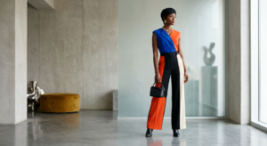 An elegant, editorial-style photograph featuring a stylish woman showcasing a bold, trend-driven col